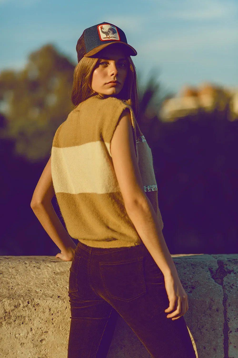 Sleeveless beige sweater with sequin detail