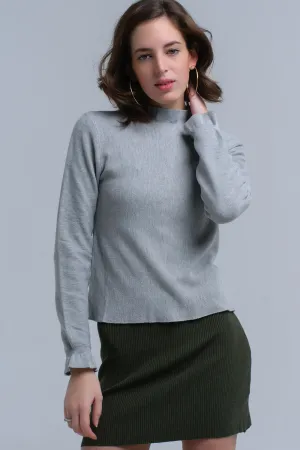 Sweater with ruffle in gray